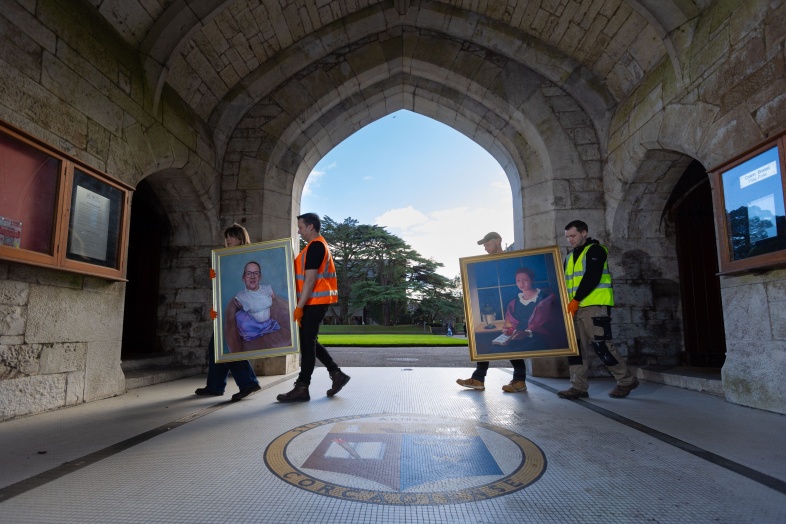 Pictured during installation are Vera Klute and Vanessa Jones' portraits. Photo Credit: Shane O'Neill